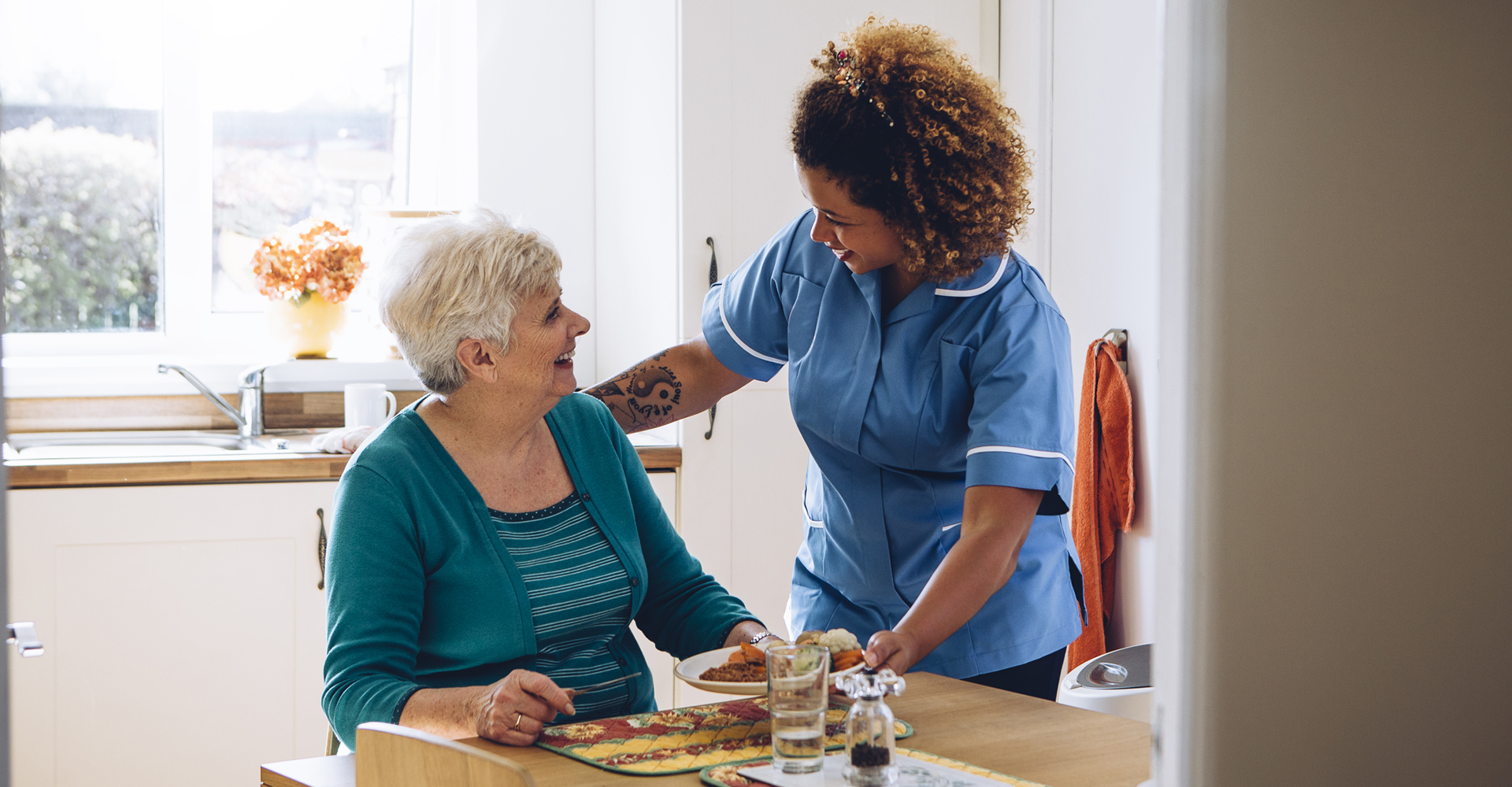 nurse taking care of an elderly woman